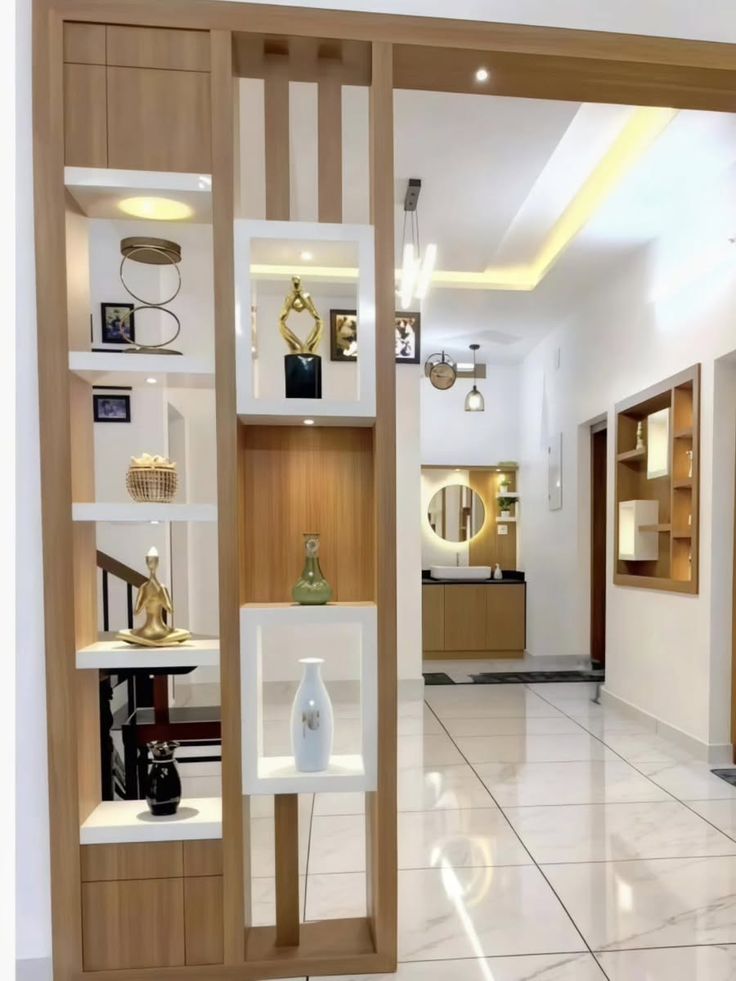 Decorative built-in cupboards for living room by Lithisha Interiors